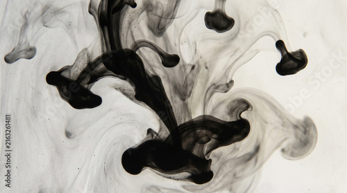 Black ink splatter abstract texture on white background for creative design projects