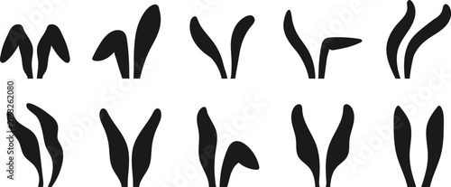 Easter bunny ears silhouettes set. Cute black rabbit ear shapes for Easter holiday design, greeting cards, and decorations. Vector illustration.