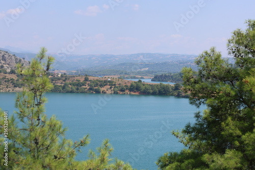 Scenic River Lake Landscape with Green Hills for Hiking Camping Tourism and Boating