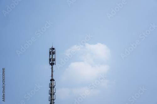 Принти на полотні Telecommunication antenna tower with 5G and 4G mobile network technology against a clear blue sky