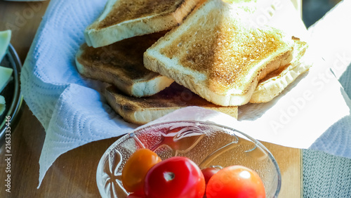 Crispy Toasted White Bread and Red Tomatoes in Bowl