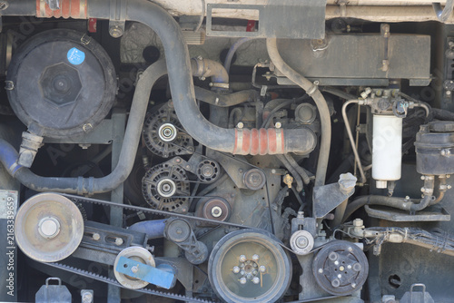 Detailed View of Heavy Vehicle Diesel Engine Bay with Pulleys Belts and Filters