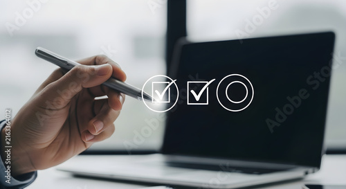 Professional Business Person Selecting Checkboxes on Digital Interface Screen for Project Management Task Completion and Workflow Process Optimization
