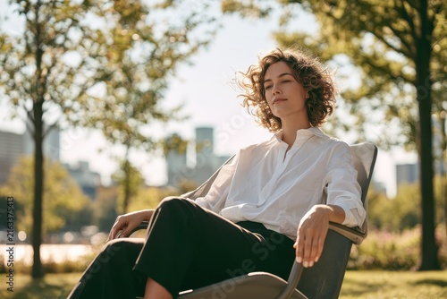 Professional woman enjoying leisure time outdoors in stylish business attire and natural light