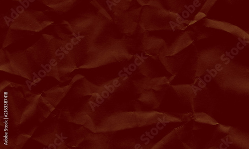 Dark red crumpled paper background with creased texture for design and creative projects Background