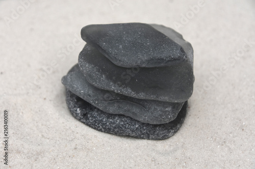 Collection of Grey Frosted Sea Glass on Sand