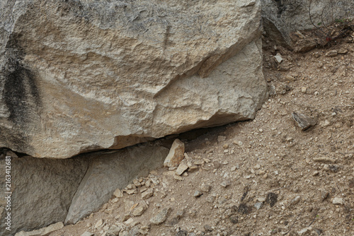 Cuadro en lienzo Massive block of Pińczów limestone surrounded by loose rubble and gravel in a qu