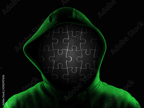 Obraz na płótnie Anonymous person with face made of black jigsaw isolated on black background