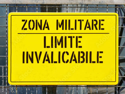 sign ban outside the military area with the italian text translation: Military zone insurmountable limit