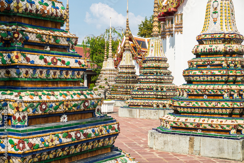 Details of the Grand Palace in Bangkok, Thailand, featuring its architecture and Buddhist religious images.