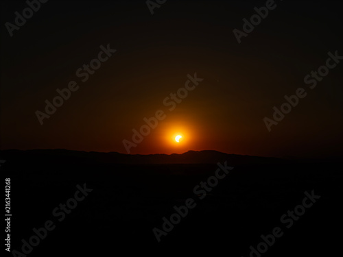 Partial solar eclipse in 2026 at the city of Zagreb, Croatia when moon covered part of the sun at sunset