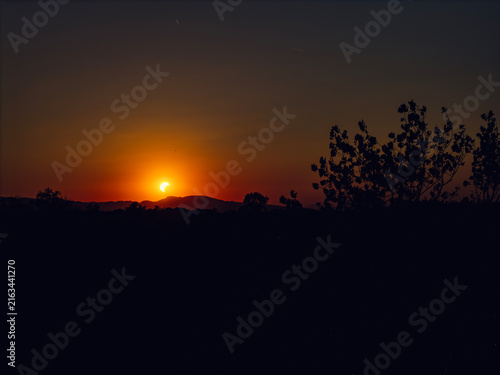 Partial solar eclipse in 2026 at the city of Zagreb, Croatia when moon covered part of the sun at sunset
