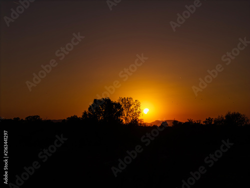 Partial solar eclipse in 2026 at the city of Zagreb, Croatia when moon covered part of the sun at sunset