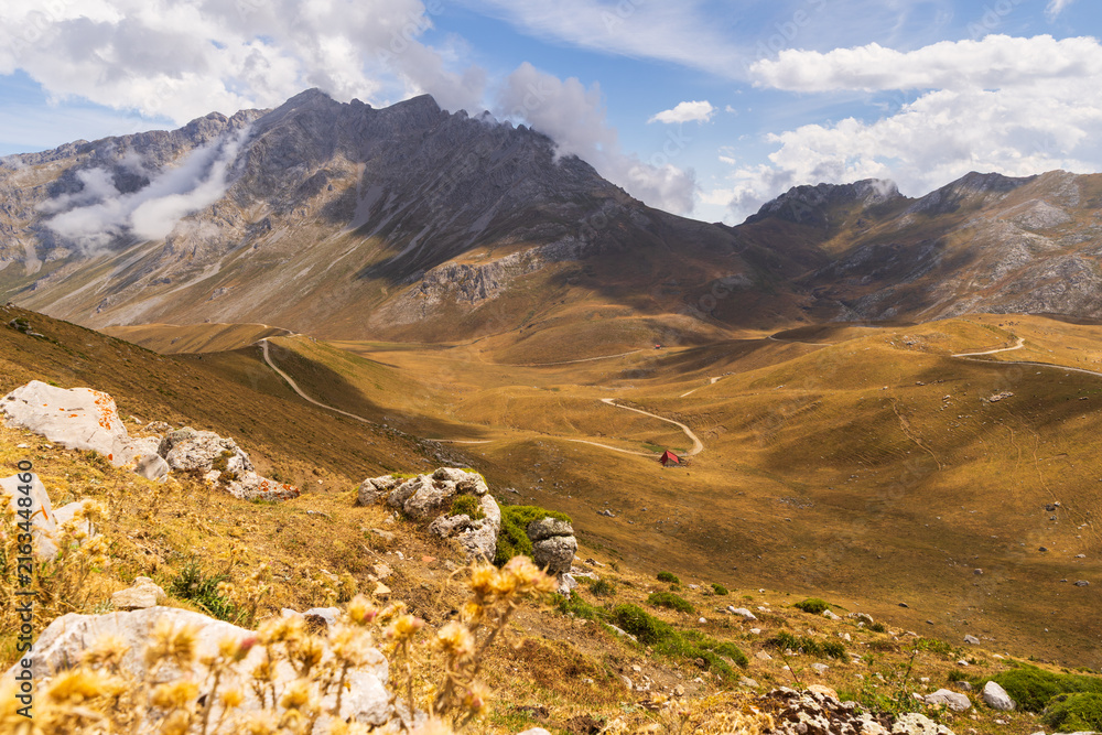 Naklejka premium Wild and deserted places, Picos mountain range in Spain, Peaks of Europe, hiking trails pass through picturesque mountain landscapes.