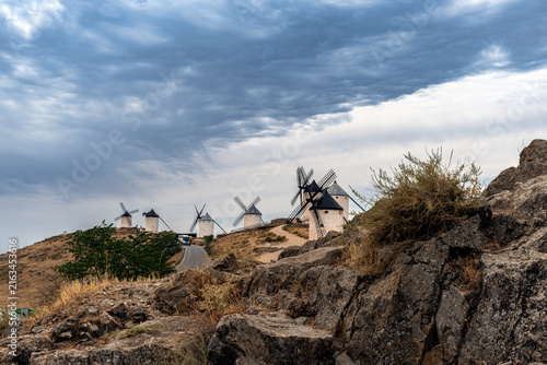 Foto Three windmills on a rocky hill