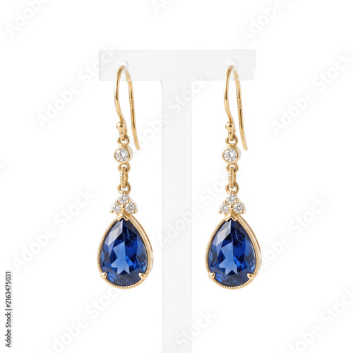 Obraz na płótnie Elegant gold drop earrings featuring pear-shaped blue sapphires and diamonds