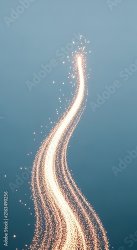 Vertical composition of a curved trail of glowing golden particles and luminous light streaks with soft bokeh effects against a solid matte blue-grey background.