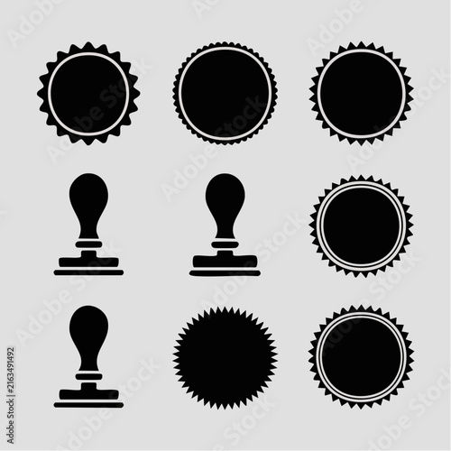 A collection of black rubber stamp icons and circular seal shapes arranged on a light.