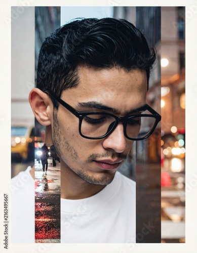 Portrait of a young man with glasses in a creative urban double exposure style