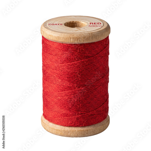 Принти на полотні Bright red thread wound on a wooden spool isolated on a transparent background