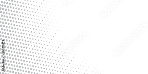 Abstract gray halftone dot pattern fading from corner. Smooth gradient dots create a clean and minimal geometric background.