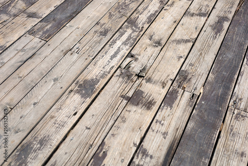 Konstfotografi Wooden deck planks with peeling dark paint
