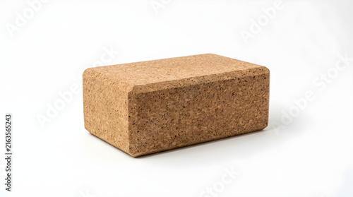 Rectangular cork yoga block for exercise and stretching support.
