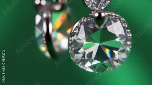 Sparkling diamond earrings swinging in graceful motion captured for this professional high quality jewelry video clip