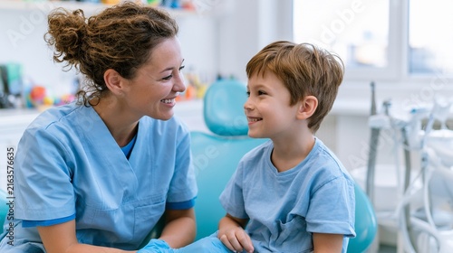 Female Pediatric Dentist Reassuring Smiling Boy Before Dental Checkup