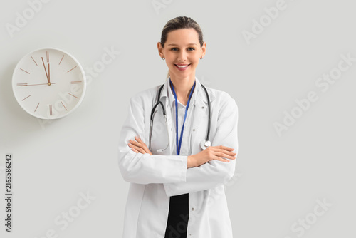 Healthcare professional portrait, confident female doctor with stethoscope an...