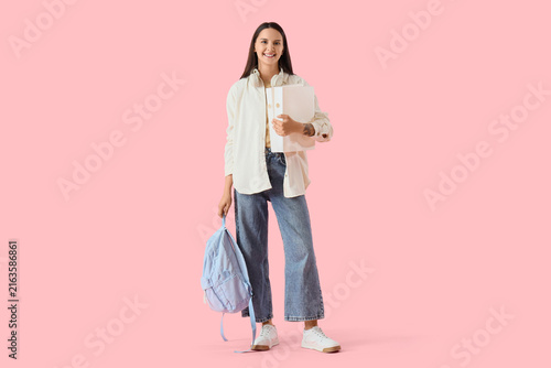 Education and learning concept happy young student woman with backpack and bo...