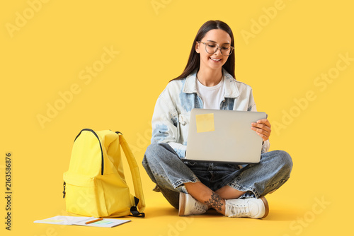 Online education and remote learning, young woman student using laptop with b...