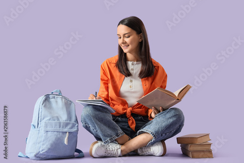 Student education and learning concept, young woman studying with books and b...