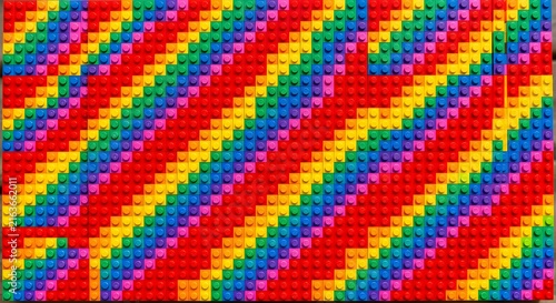 Vibrant diagonal pixel art stripes in bold rainbow colors for digital design backgrounds