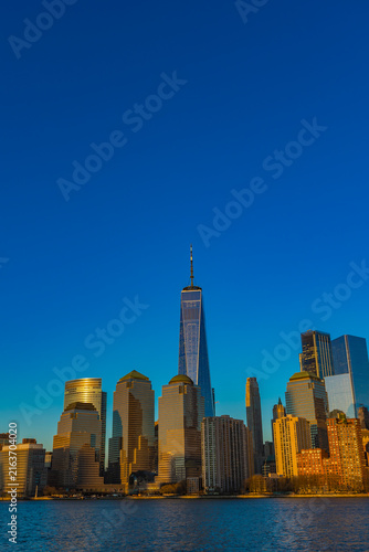 Stunning skyline of New York City bathed in golden sunlight at dusk