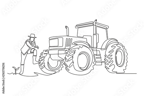 Continuous one line drawing young male farmer leaning on heavy agricultural tractor tire while looking down at growing seedling in cultivated field. Single line draw design vector graphic illustration