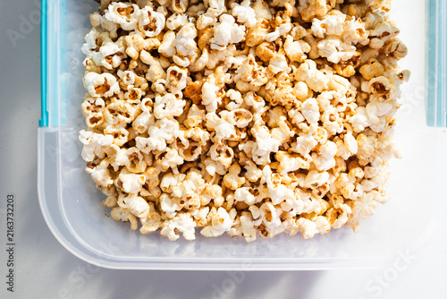 popcorn in clear container for organized food storage and healthy snacking