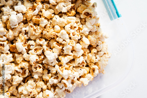 popcorn in clear container for organized food storage and healthy snacking