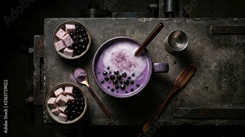 Creamy Taro Milk Tea with Tapioca Pearls and Purple Sweet Potato Topping Served in a Rustic Setting
