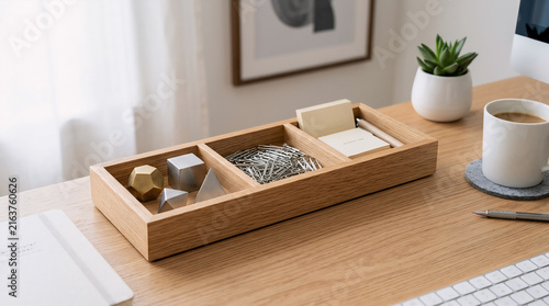 Minimalist wooden desk organizer with stationery on modern workspace