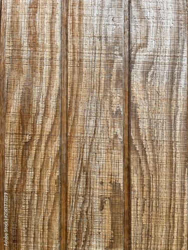 Close up of distressed oak veneer with heavy scratch patterns. Macro details of weathered vertical grain wood laminate surface. Scratched industrial timber plank layout for textured overlays.