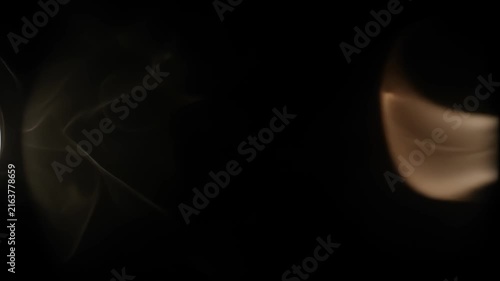 Cinematic light leak and warm optical bloom overlay animation on black background.