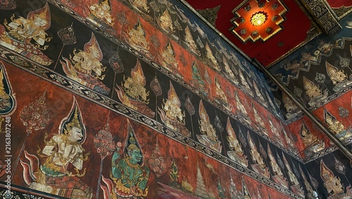 Принти на полотні Traditional Thai Buddhist mural painting depicting Buddhist mythology on the temple wall in Bangkok, Thailand