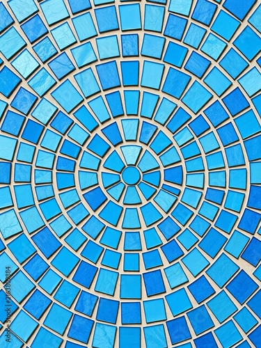 Blue abstract mosaic seamless pattern fragments of a circle laid out from tiles trencadis vector background, design, circle