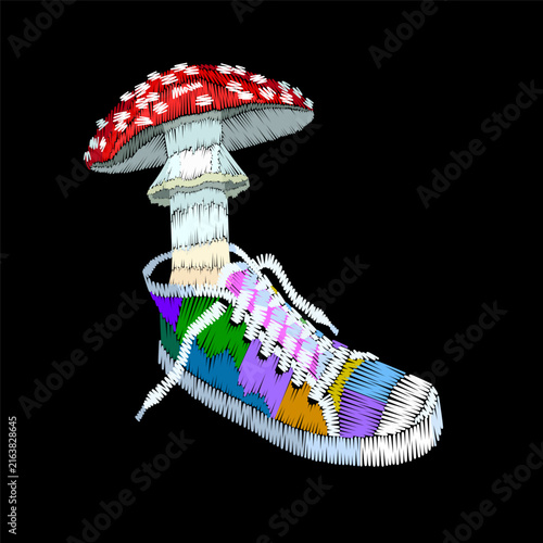 Colorful sneaker with red mushroom embroidery design. Surreal folk needlework stitch style. Clothing towel bag jacket back cover print. Black background hand-stitched vector art.