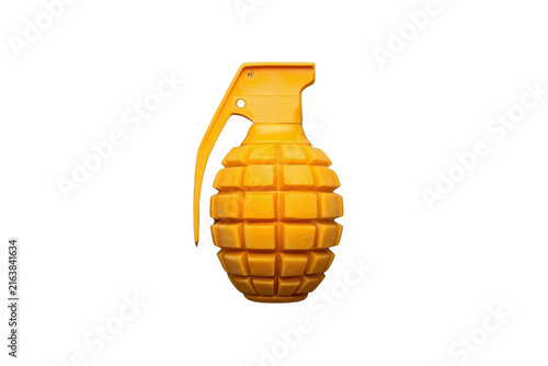 Yellow toy hand grenade representing danger and play