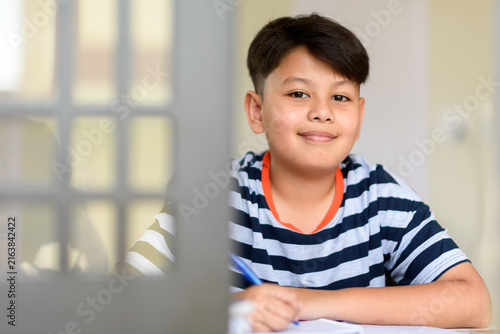 Bild auf Leinwand Happy student smiling achieving academic success studying school curriculum
