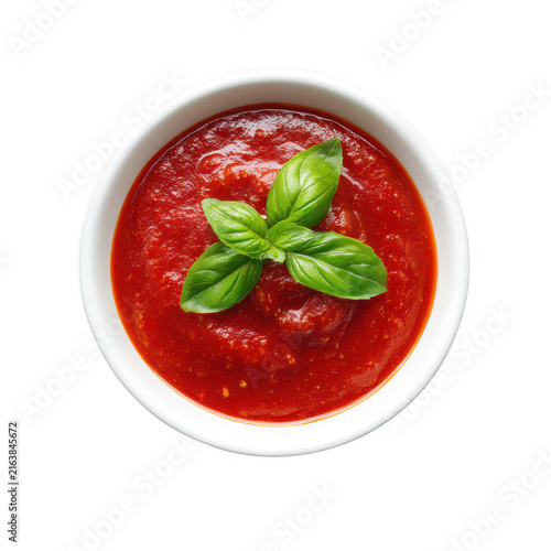 Fresh tomato sauce in a white bowl with green basil leaves isolated on transparent background