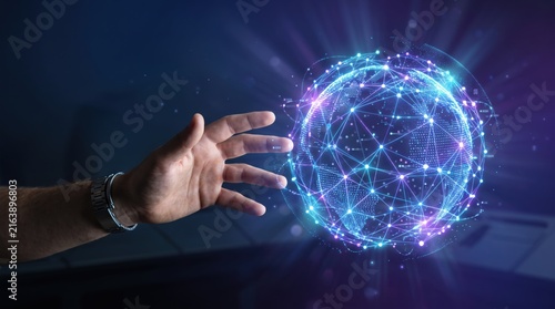 Human hand reaching out to touch a glowing futuristic digital globe network, representing global connectivity, internet data communication, virtual reality technology