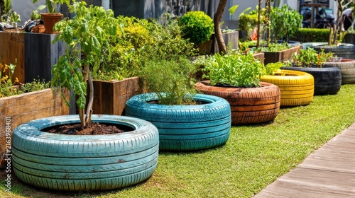 Colorful Tire Planters with Lush Greenery in a Sunny Garden Scene